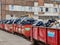 Several red containers of rubbish packed in big black plastic bags in Gdansk shipyard area