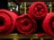 Several red rolls of knitted fabric. Woven factory or warehouse