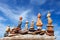 Several Rock zen pyramids of colorful pebbles on a beach on the background of the sea. Concept of balance, harmony and meditation