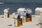 Several roofed wicker beach chairs