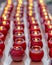 Several rows of red buddhist prayer candle