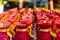 Several rows of red buddhist prayer candles