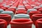 Several rows of red and white stadium seats