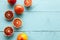 Several sanguine oranges on blue wooden background