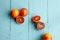 Several sanguine oranges on blue wooden background