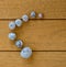 Several seashells on a brown wood textured plastic background