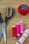 Several sewing tools with red pincushion
