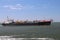 several ships loading and unloading in the Harbor of Rotterdam, the Netherlands.