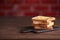 Several slices of toasted bread toasts on a wooden dark background