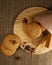 several sweet round cookies with light brown cracks lie on a wooden kitchen brown stand