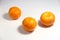 Several tangerines on a white background