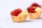 Several tartlets with red caviar and butter isolated on white ba
