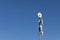 Several telecommunications antennas of a cellular network and wireless internet against a blue sky. Receiving and