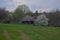 Several traditional Ukrainian old huts with thatched roofs.