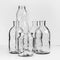 Several Transparent Empty Glass-works. Black and white vintage background.