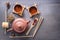 Several types of green tea, black tea, hibiscus tea and tea ceremony attributes - a ceramic teapot, cups, a strainer,