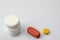 Several types of pills or tablets, maybe narcotic, antibiotic or aspirin,  on white background. Medicine and pharmacy concept.