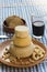 Several vegan cheeses on wooden table .