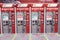 several vending machines are displayed in an airport station stall