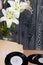 Several vinyl records and blossoming lilies against a background of black and white pine boards