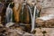 Several waterfalls flowing down the high rock in Martvili canyon