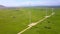 Several Wind Generator Towers among Green Fields