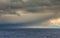 Several windmills off the coast of Tynemouth in the northeast of England, on a cloudy with a faint rainbow in view