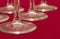 Several wine glasses on red