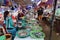 Several women in the fish selling area of the Ba Le market in Hoi An