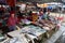 Several women sell fish at a stall in the Ba Le market in Hoi An