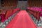 several wooden and red velvet chairs from the concert hall at Coliseu dos recreios in Lisbon