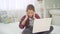 Severe headache in a child who sits at the laptop doing homework