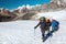 Severe Mountain Climbers in weather protective Clothing on Glacier