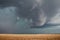 A severe supercell storm containing rain, hail, and damaging winds approaches.