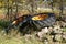 Severed old tractor tires left on  rock pile