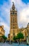 SEVILLA, SPAIN, JANUARY 7, 2016: people are strolling in front of the la giralda tower in the spanish city sevilla