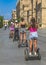 Seville, Andalusia / Spain - September 9, 2019: The young girls visiting the city center near the Cathedral during the Segway tour