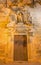 Seville - The side baroque portal of the church Iglesia de Santa Maria Magdalena with the statue of Santo Domingo de Guzman