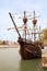SEVILLE, SPAIN - 18 March, 2022: Nao Victoria replica ship docked at the Guadalquivir River in the historic central