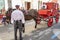 Seville, Spain - April  15, 2018: Horse drawn carriage of beer delivery in Seville April Fair