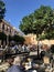 Seville, Spain - December 23, 2019: People enjoying the sun in the small square of San Andres, in outdoor cafes