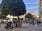 Seville, Spain - December 23, 2019: People enjoying the sun in the small square of San Andres, in outdoor cafes