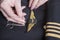 Sew pilot wings onto uniform