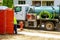 Sewage truck on worker pumping feces out of rental toilet for disposal and cleaning