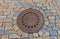 Sewer manhole with Ñoat of arms of Kutna Hora, Czech Republic