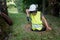 Sewer repair works in the manhole by a woman worker