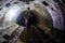 Sewer worker in underground sewer tunnel