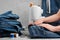 Sewing jeans on sewing machine in tailor workshop. Jeans repair