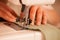 Sewing Process - Women taylor\'s hands behind her sewing machine