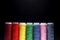 Sewing Quilting Thread, Rainbow colors. on black background with place for your own text